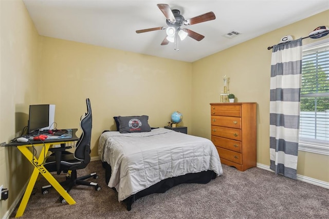 605 S Timber Ridge Dr, Cushing, OK 74023 - bedroom with carpet floors, multiple windows, baseboards, and ceiling fan