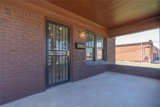 2301 N Kelham Ave, Oklahoma City, OK 73111 - doorway to property featuring brick siding