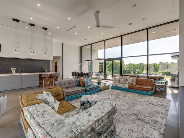 11300 N Westminster Rd, Jones, OK 73049 - living area featuring a wall of windows, a ceiling fan, recessed lighting, and finished concrete floors