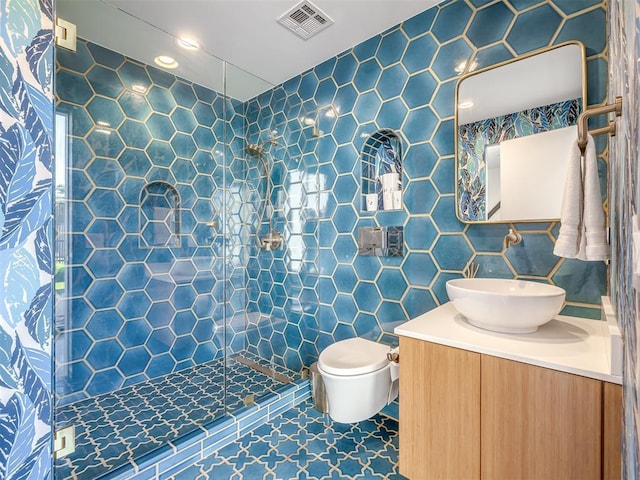 11300 N Westminster Rd, Jones, OK 73049 - bathroom featuring tiled shower, vanity, toilet, and tile walls