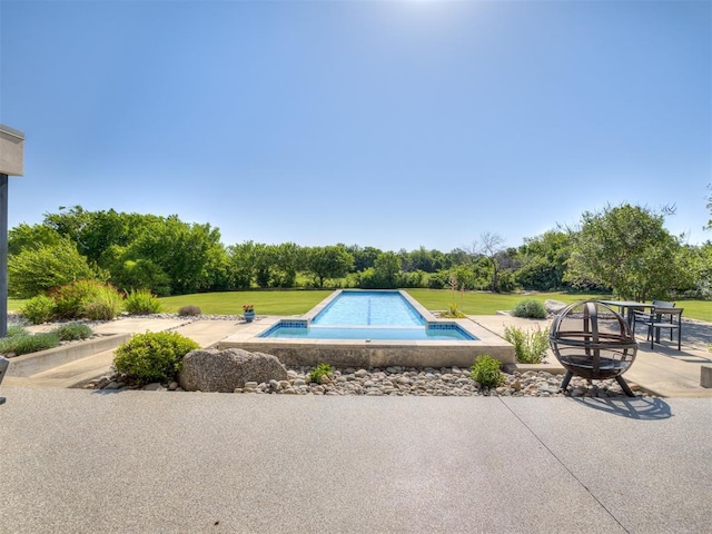 11300 N Westminster Rd, Jones, OK 73049 - view of pool with a patio, a hot tub, an outdoor fire pit, an infinity pool, and a lawn