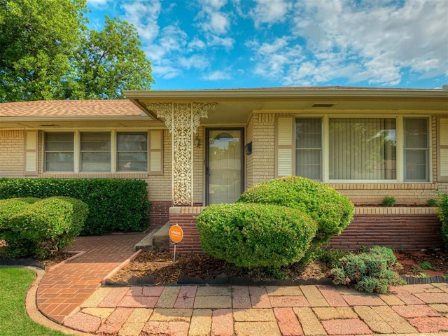 513 SW 57th St, Oklahoma City, OK 73109 - property entrance featuring brick siding