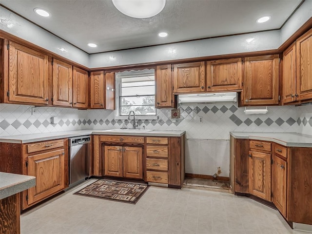 513 SW 57th St, Oklahoma City, OK 73109 - kitchen with a sink, stainless steel dishwasher, brown cabinets, tasteful backsplash, and recessed lighting