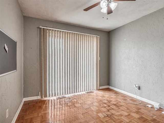 513 SW 57th St, Oklahoma City, OK 73109 - unfurnished room featuring a ceiling fan, a textured wall, and baseboards