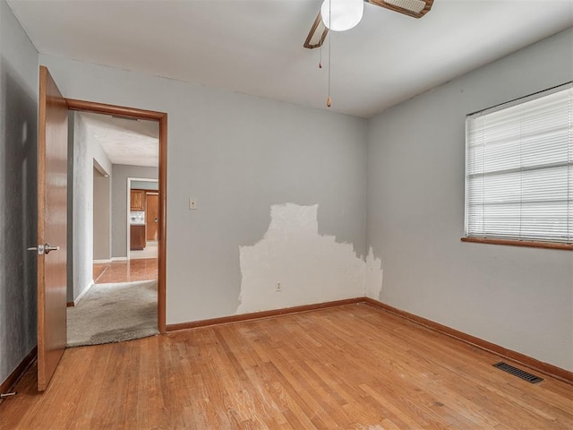 513 SW 57th St, Oklahoma City, OK 73109 - spare room featuring light wood-type flooring, baseboards, and ceiling fan