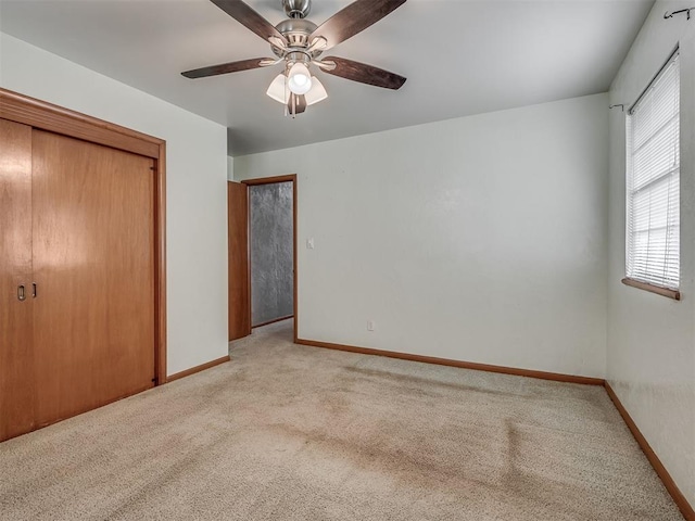 513 SW 57th St, Oklahoma City, OK 73109 - unfurnished bedroom with light carpet, a closet, baseboards, and ceiling fan