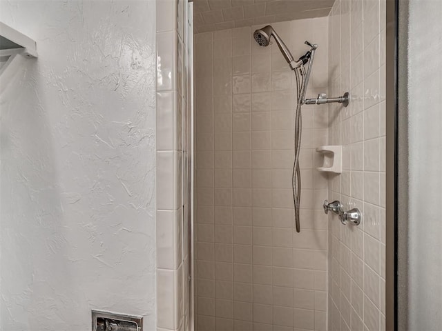 513 SW 57th St, Oklahoma City, OK 73109 - bathroom view of a tile shower and a textured wall