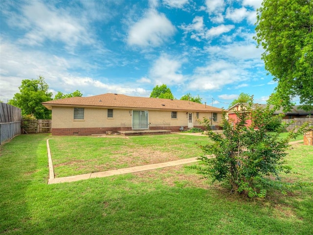 513 SW 57th St, Oklahoma City, OK 73109 - back of house featuring brick siding and crawl space