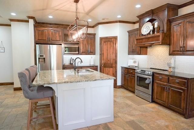 710 Isaiah Ln, Tuttle, OK 73089 - kitchen with stainless steel appliances, a sink, recessed lighting, crown molding, and backsplash