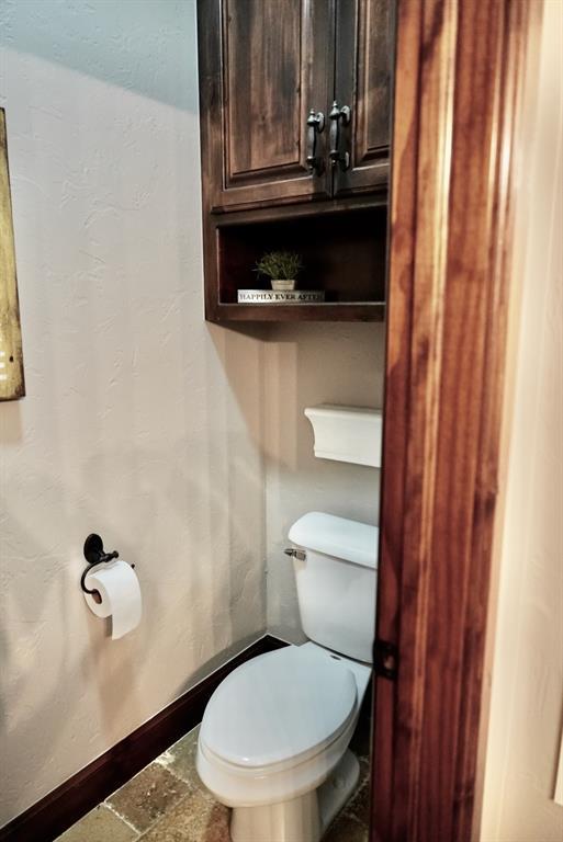 710 Isaiah Ln, Tuttle, OK 73089 - bathroom featuring toilet and baseboards