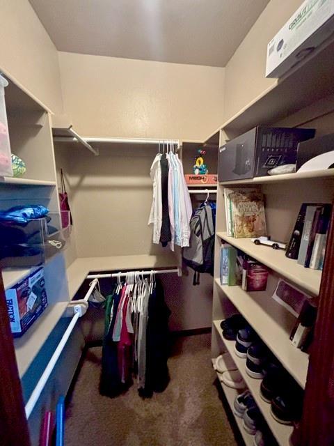 710 Isaiah Ln, Tuttle, OK 73089 - spacious closet featuring carpet