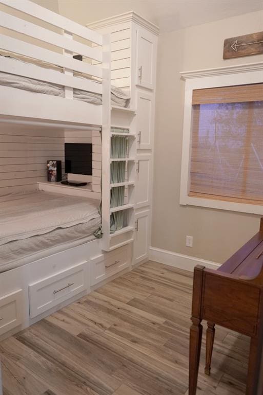 710 Isaiah Ln, Tuttle, OK 73089 - bedroom featuring light wood finished floors and baseboards