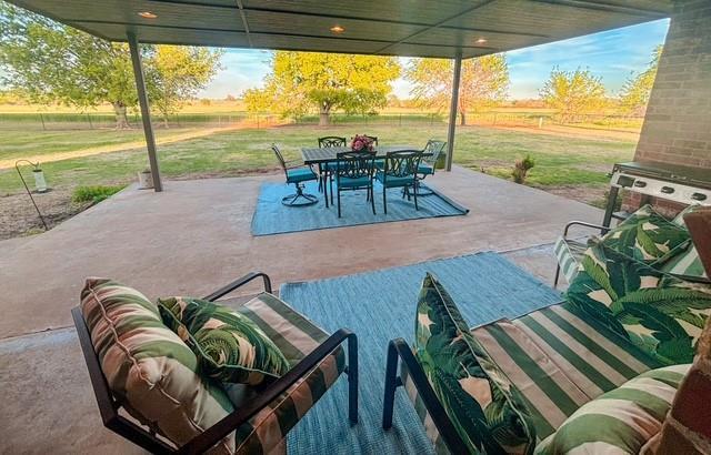 710 Isaiah Ln, Tuttle, OK 73089 - view of patio / terrace featuring outdoor dining space
