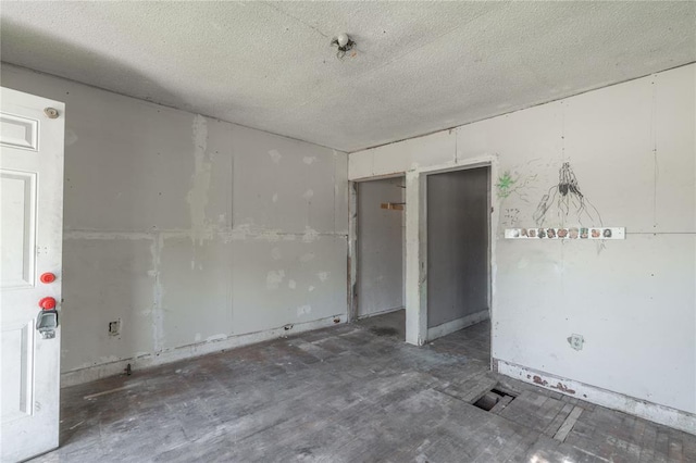 820 W Highland St, Shawnee, OK 74801 - empty room with a textured ceiling
