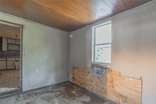 820 W Highland St, Shawnee, OK 74801 - unfurnished room featuring wood ceiling and concrete flooring