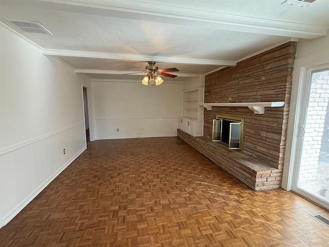 1908 NW 56th Ter, Oklahoma City, OK 73118 - unfurnished living room featuring a ceiling fan, beamed ceiling, built in shelves, a fireplace, and baseboards