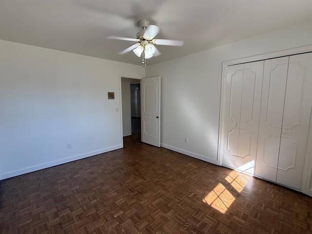 1908 NW 56th Ter, Oklahoma City, OK 73118 - unfurnished bedroom with baseboards, ceiling fan, and a closet