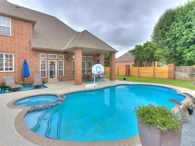 2508 Thunderwind Cir, Edmond, OK 73034 - view of swimming pool featuring a patio area and a pool with connected hot tub