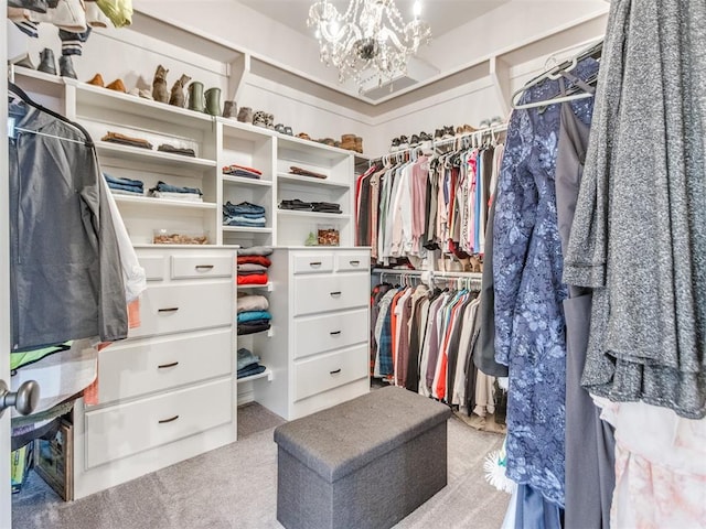 2508 Thunderwind Cir, Edmond, OK 73034 - walk in closet featuring a chandelier