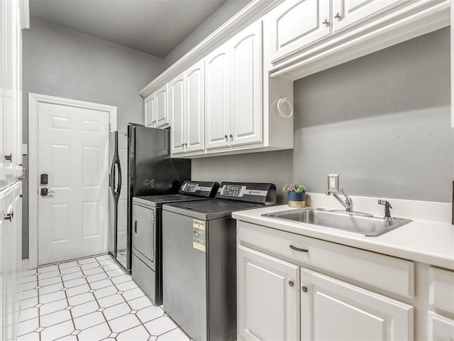 2508 Thunderwind Cir, Edmond, OK 73034 - laundry area with washing machine and dryer, cabinet space, and light floors