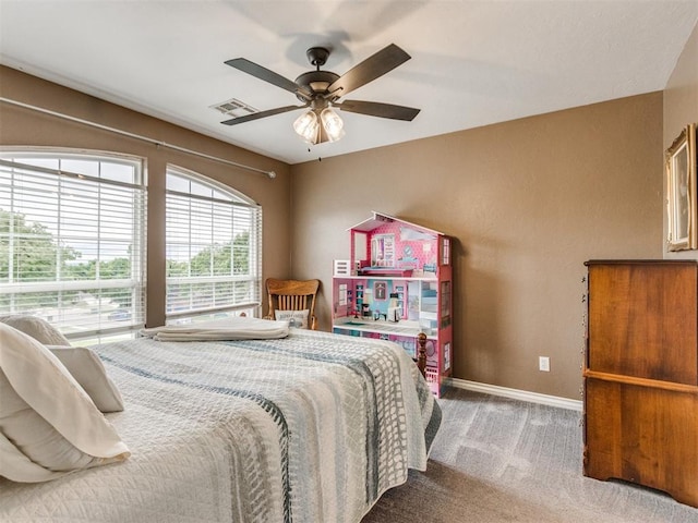 2508 Thunderwind Cir, Edmond, OK 73034 - bedroom featuring carpet floors, baseboards, and a ceiling fan