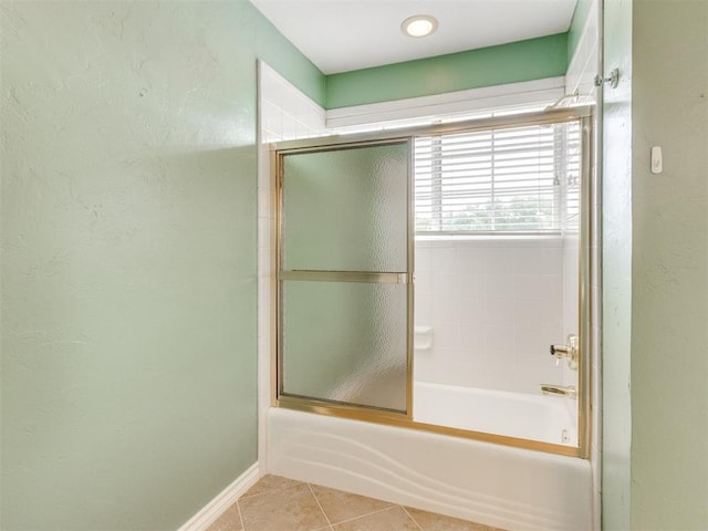 2508 Thunderwind Cir, Edmond, OK 73034 - bathroom with combined bath / shower with glass door, tile patterned floors, and baseboards