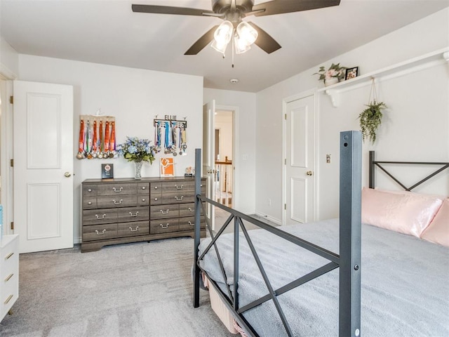 2508 Thunderwind Cir, Edmond, OK 73034 - bedroom featuring light colored carpet and a ceiling fan