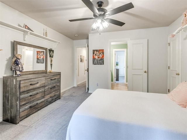 2508 Thunderwind Cir, Edmond, OK 73034 - bedroom featuring carpet, baseboards, and a ceiling fan
