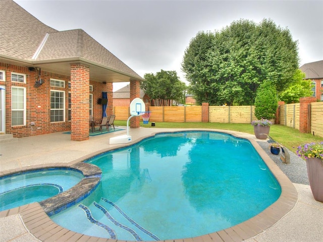 2508 Thunderwind Cir, Edmond, OK 73034 - view of swimming pool featuring a patio area, a fenced backyard, and a pool with connected hot tub