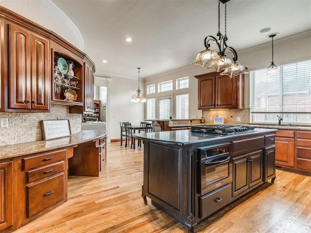 2508 Thunderwind Cir, Edmond, OK 73034 - kitchen featuring wall oven, stainless steel gas cooktop, tasteful backsplash, light wood-style flooring, and open shelves