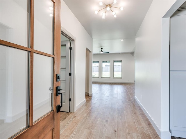 11508 NW 102nd St, Yukon, OK 73099 - hallway with light wood-style floors and baseboards