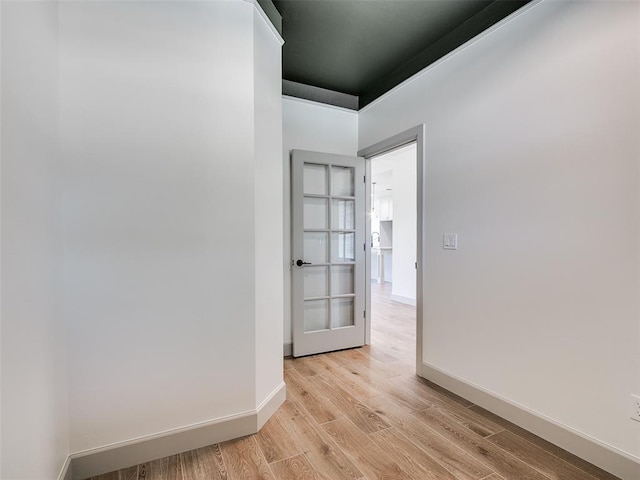 11508 NW 102nd St, Yukon, OK 73099 - spare room featuring light wood finished floors, baseboards, and french doors
