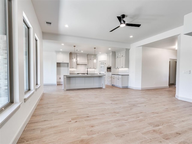 11508 NW 102nd St, Yukon, OK 73099 - kitchen featuring open floor plan, a ceiling fan, pendant lighting, baseboards, and recessed lighting