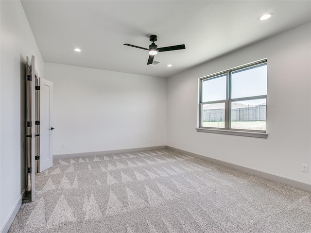 11508 NW 102nd St, Yukon, OK 73099 - empty room featuring light colored carpet, a ceiling fan, recessed lighting, and baseboards