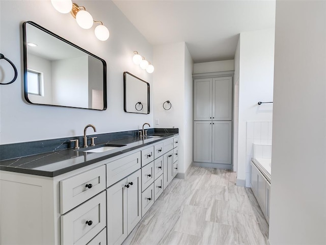11508 NW 102nd St, Yukon, OK 73099 - bathroom featuring double vanity, a garden tub, and marble finish floors