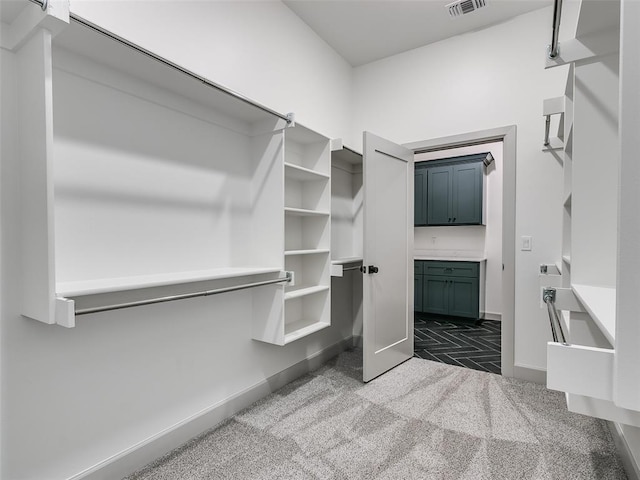 11508 NW 102nd St, Yukon, OK 73099 - spacious closet featuring dark carpet