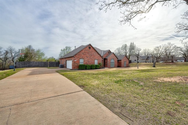 10904 Quail Run Rd, Oklahoma City, OK 73150 - view of front of house with brick siding, concrete driveway, and an attached garage