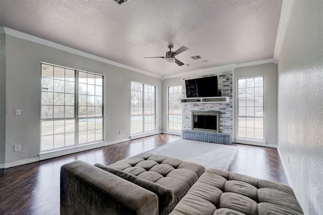 10904 Quail Run Rd, Oklahoma City, OK 73150 - living area with wood finished floors, a textured ceiling, crown molding, healthy amount of natural light, and ceiling fan