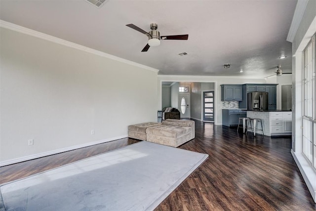 10904 Quail Run Rd, Oklahoma City, OK 73150 - living area featuring ceiling fan, crown molding, dark wood-style flooring, and baseboards