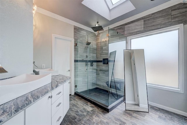 10904 Quail Run Rd, Oklahoma City, OK 73150 - full bathroom featuring a skylight, ornamental molding, a stall shower, vanity, and baseboards