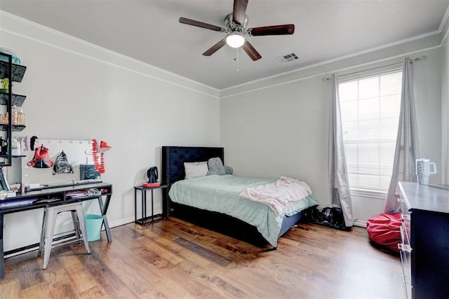 10904 Quail Run Rd, Oklahoma City, OK 73150 - bedroom with crown molding, wood finished floors, and ceiling fan