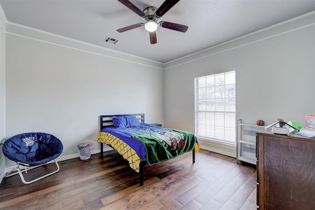 10904 Quail Run Rd, Oklahoma City, OK 73150 - bedroom with wood finished floors, crown molding, baseboards, and a ceiling fan