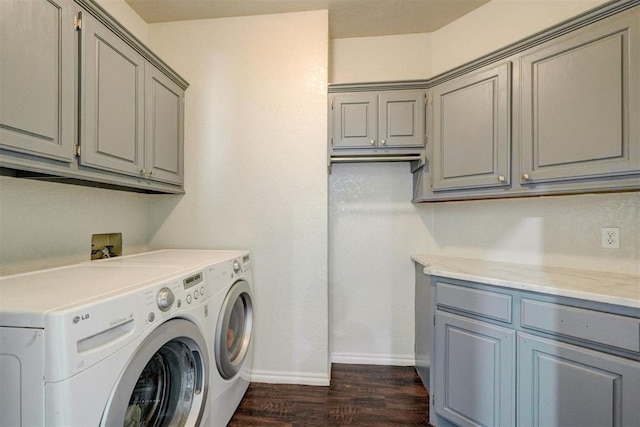 10904 Quail Run Rd, Oklahoma City, OK 73150 - washroom featuring washer and dryer, cabinet space, dark wood-style flooring, and baseboards