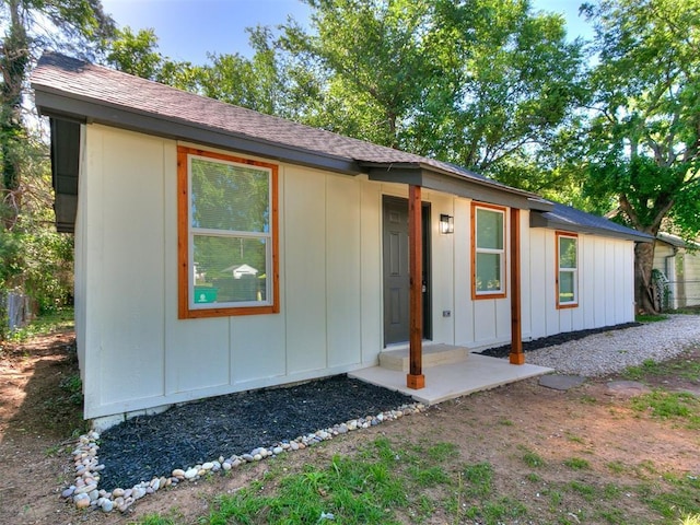 920 N Warren Ave, Oklahoma City, OK 73107 - view of front of home featuring board and batten siding and a shingled roof