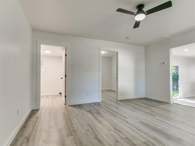 920 N Warren Ave, Oklahoma City, OK 73107 - spare room featuring light wood-style flooring, ceiling fan, and baseboards