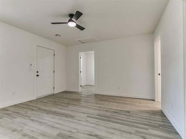 920 N Warren Ave, Oklahoma City, OK 73107 - empty room featuring attic access, light wood finished floors, baseboards, and a ceiling fan