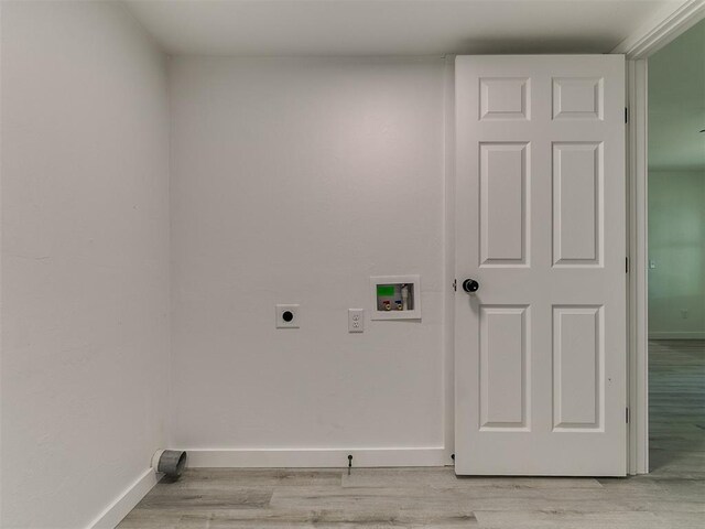 920 N Warren Ave, Oklahoma City, OK 73107 - washroom featuring electric dryer hookup, hookup for a washing machine, light wood finished floors, and baseboards