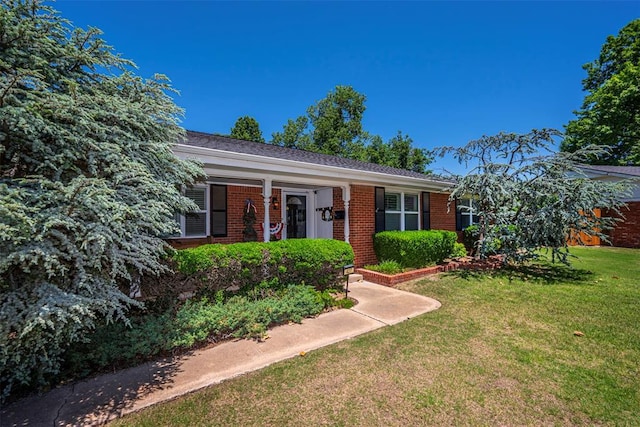 427 Foreman Ave, Norman, OK 73069 - view of front of house featuring brick siding and a front yard