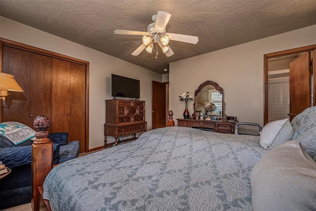 427 Foreman Ave, Norman, OK 73069 - carpeted bedroom featuring a closet, a textured ceiling, and ceiling fan