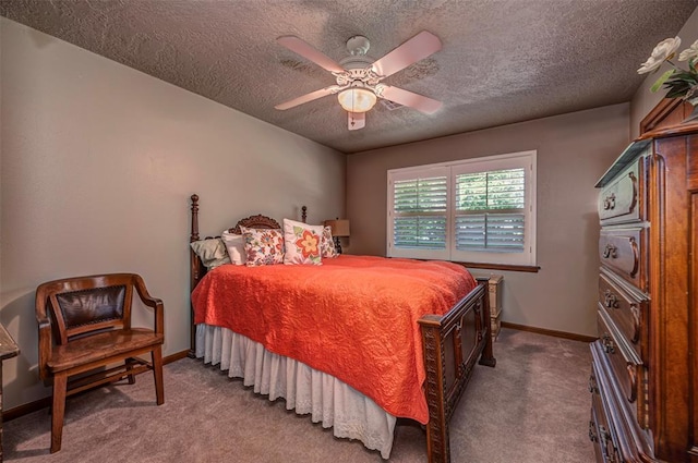 427 Foreman Ave, Norman, OK 73069 - bedroom with a textured ceiling, carpet floors, baseboards, and a ceiling fan